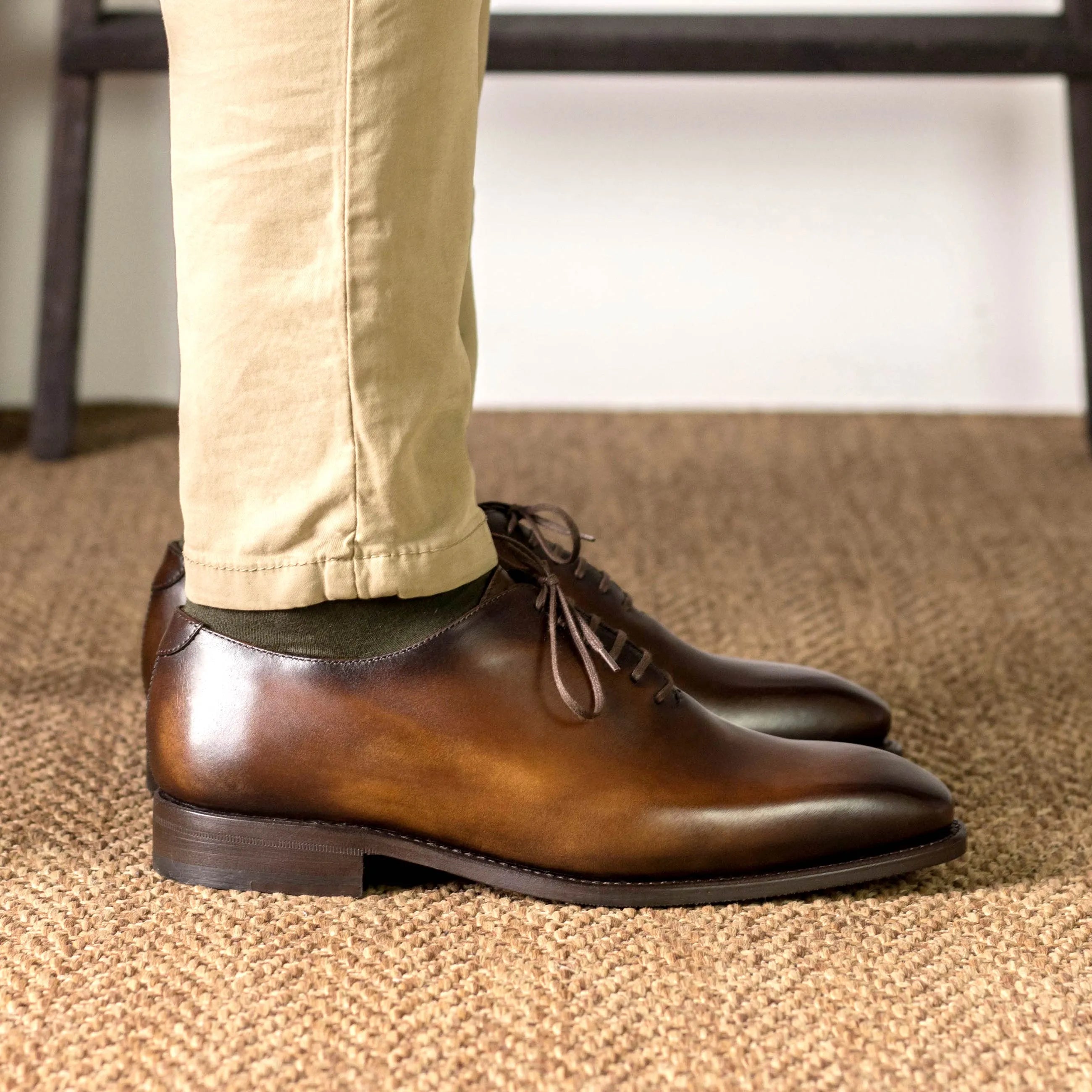 Renzo wholecut shoes: brown leather dress shoes back view
