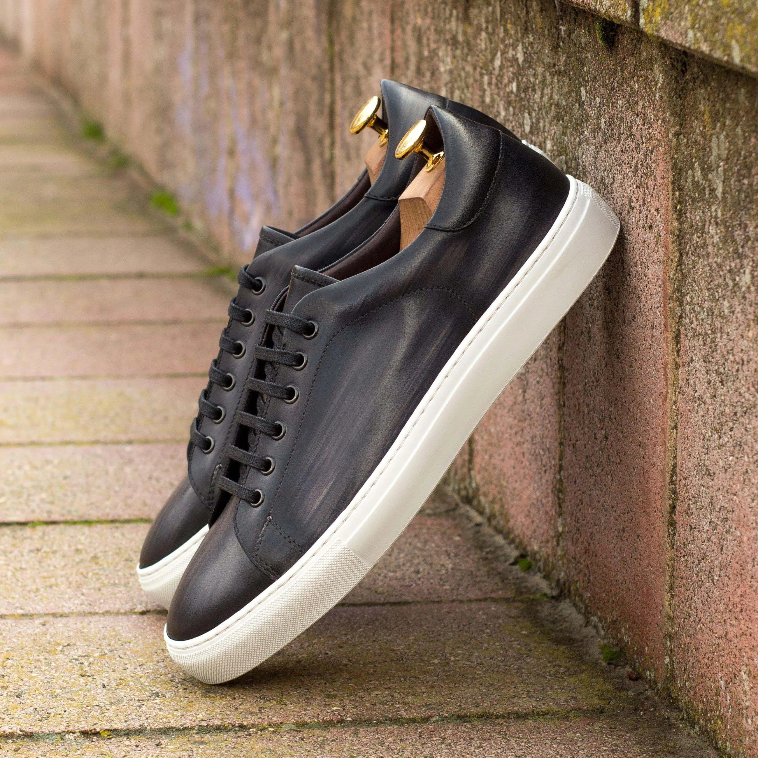 Black C68 trainer patina sneaker II with white cupsole soles