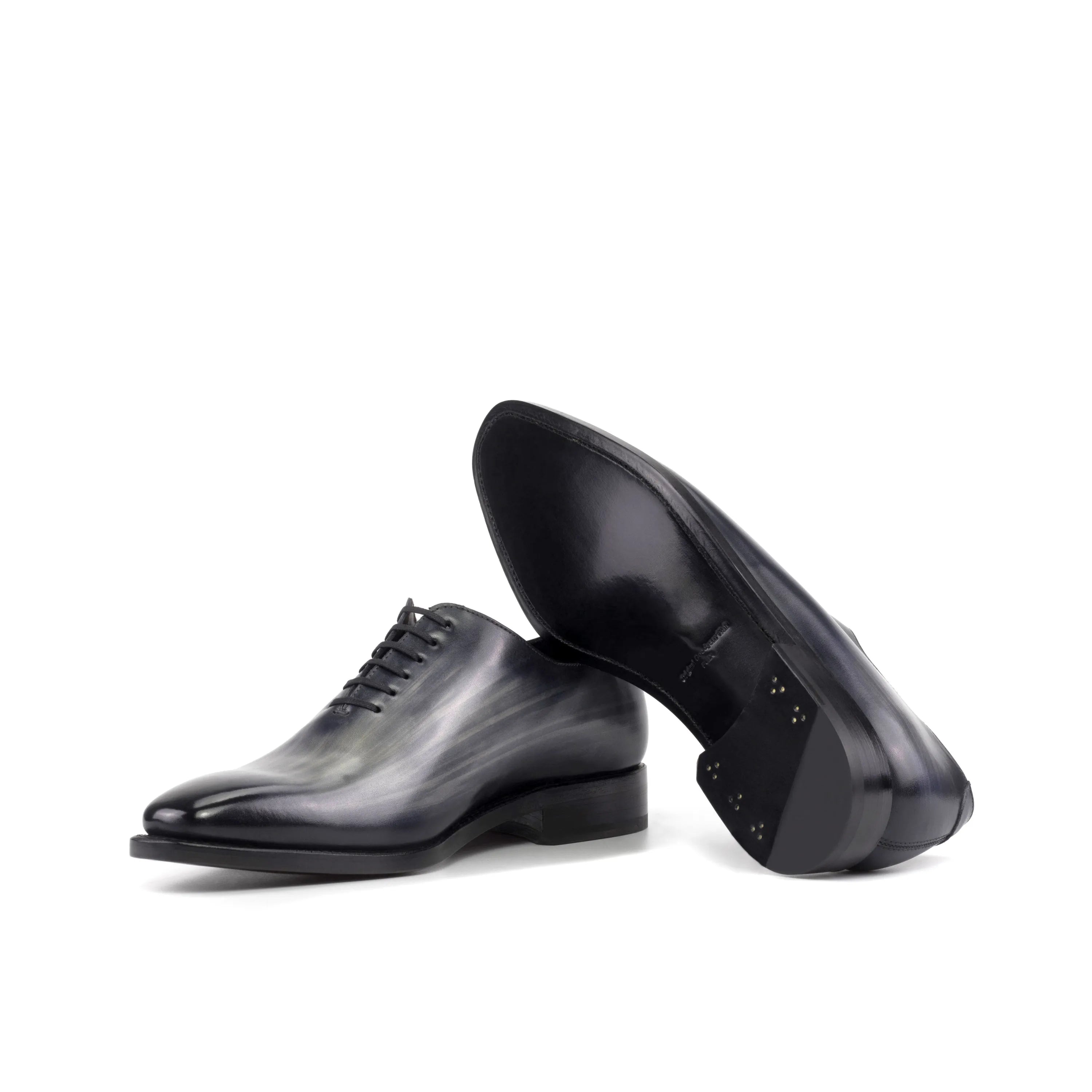 Pair of gray leather Eclipse Patina Wholecut shoes