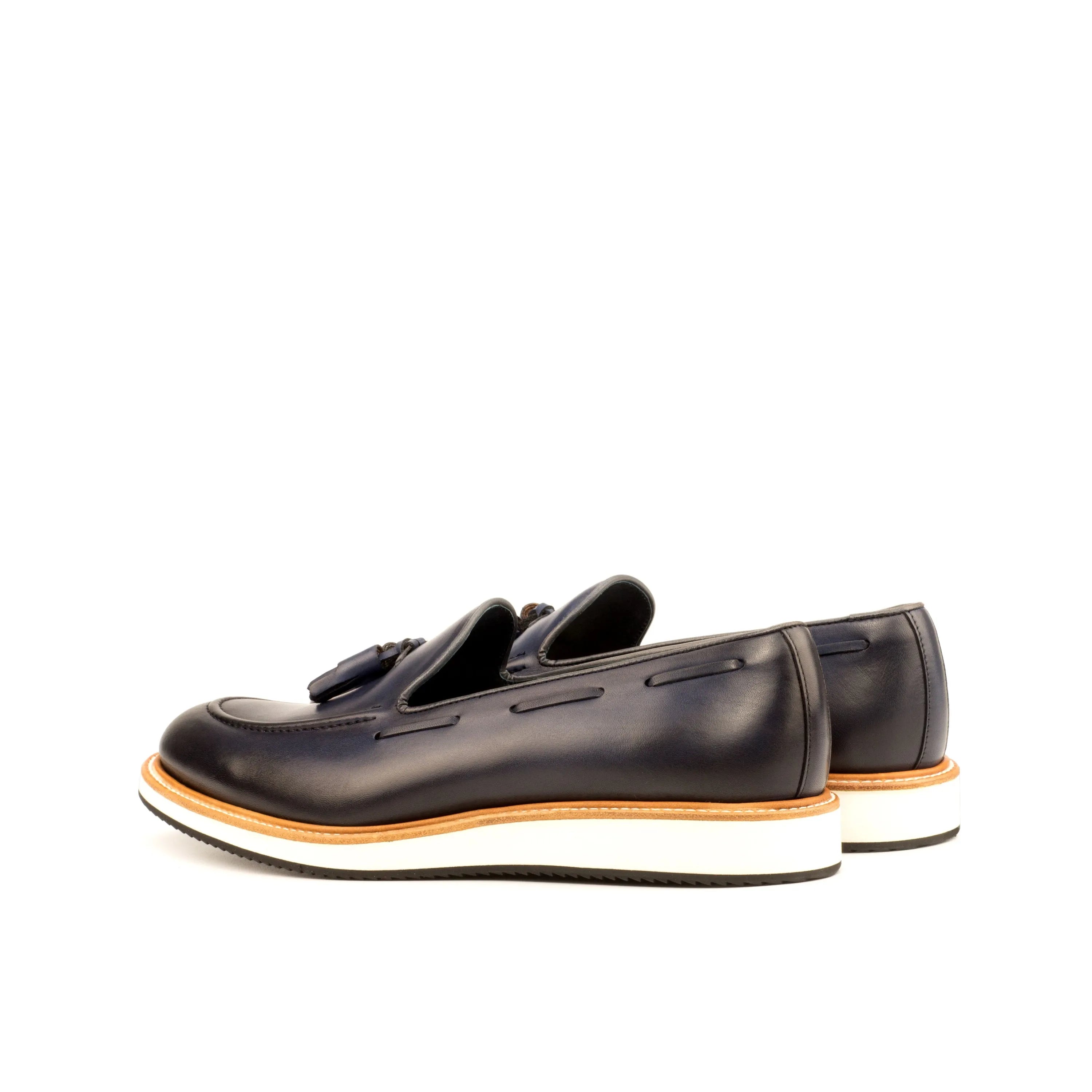Pair of black leather tassel Lodino loafers, luxury bespoke shoes for men